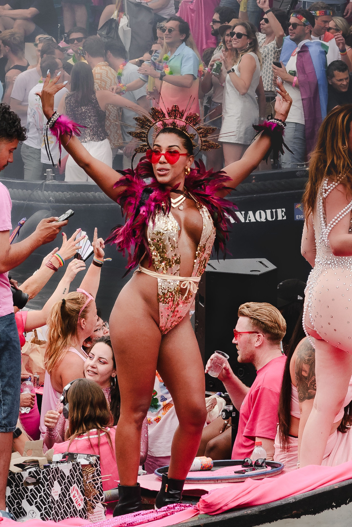 Smiling performer in colorful outfit engaging with the crowd, highlighting emotion and joy.