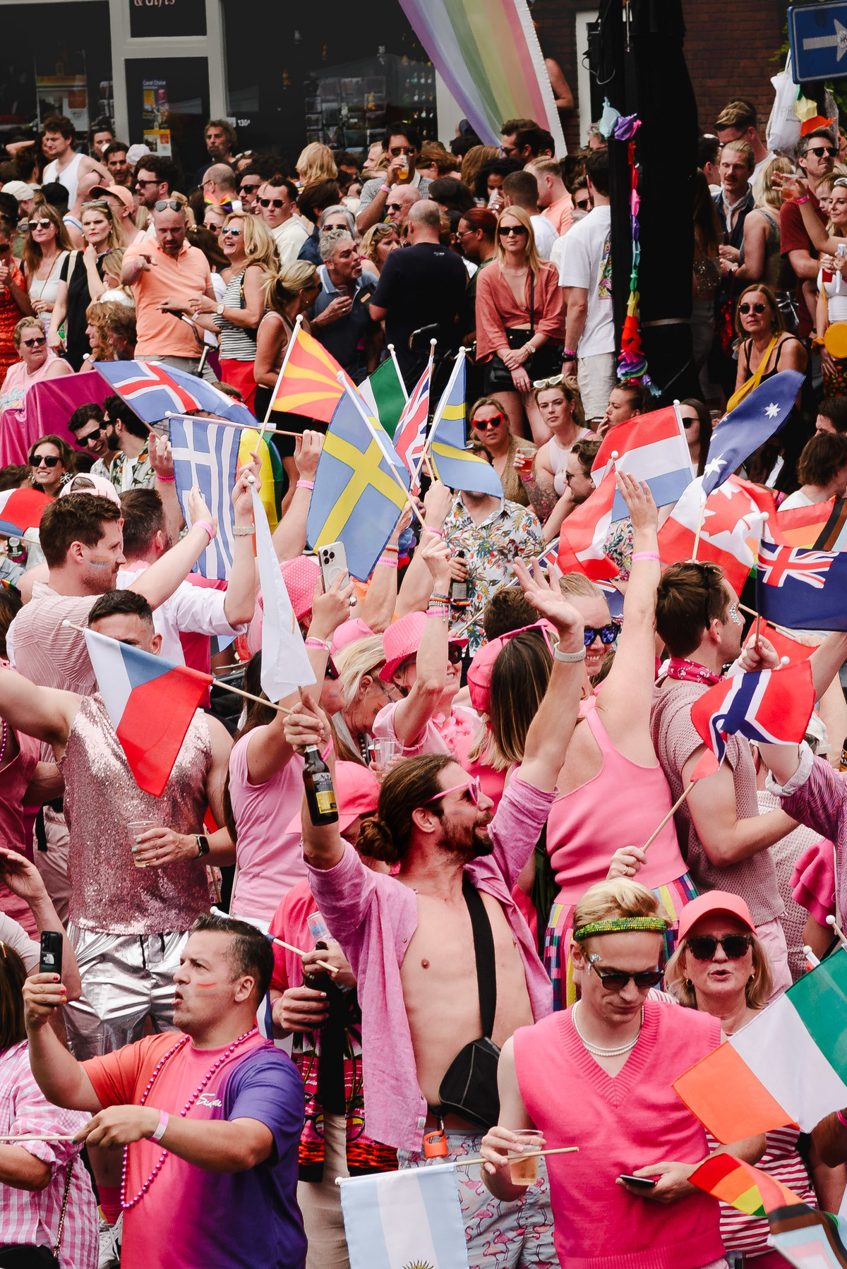 Wide-angle view of boats arriving at the canal parade, showing energy and movement in the scene.