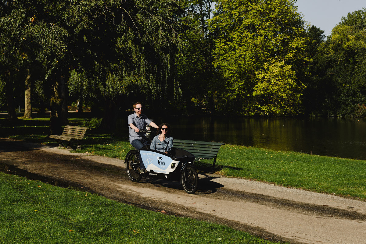 Couple on a cargo bike urban arrow in Amsterdam, The Netherlands