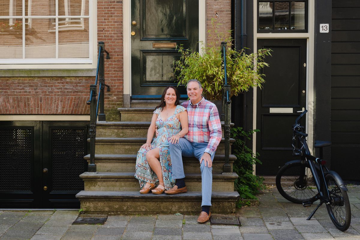 Anniversary photo on canal bridge in Amsterdam