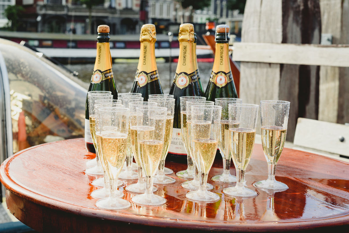 Wedding toast on canal boat after Gemeente Amsterdam ceremony