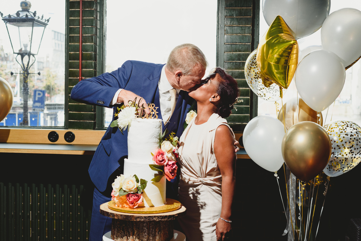 Wedding cake cutting at intimate Amsterdam reception venue