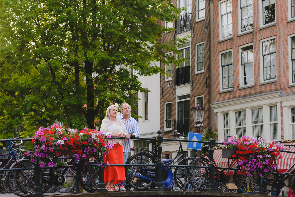 Couple standing by canal near Anne Frank House