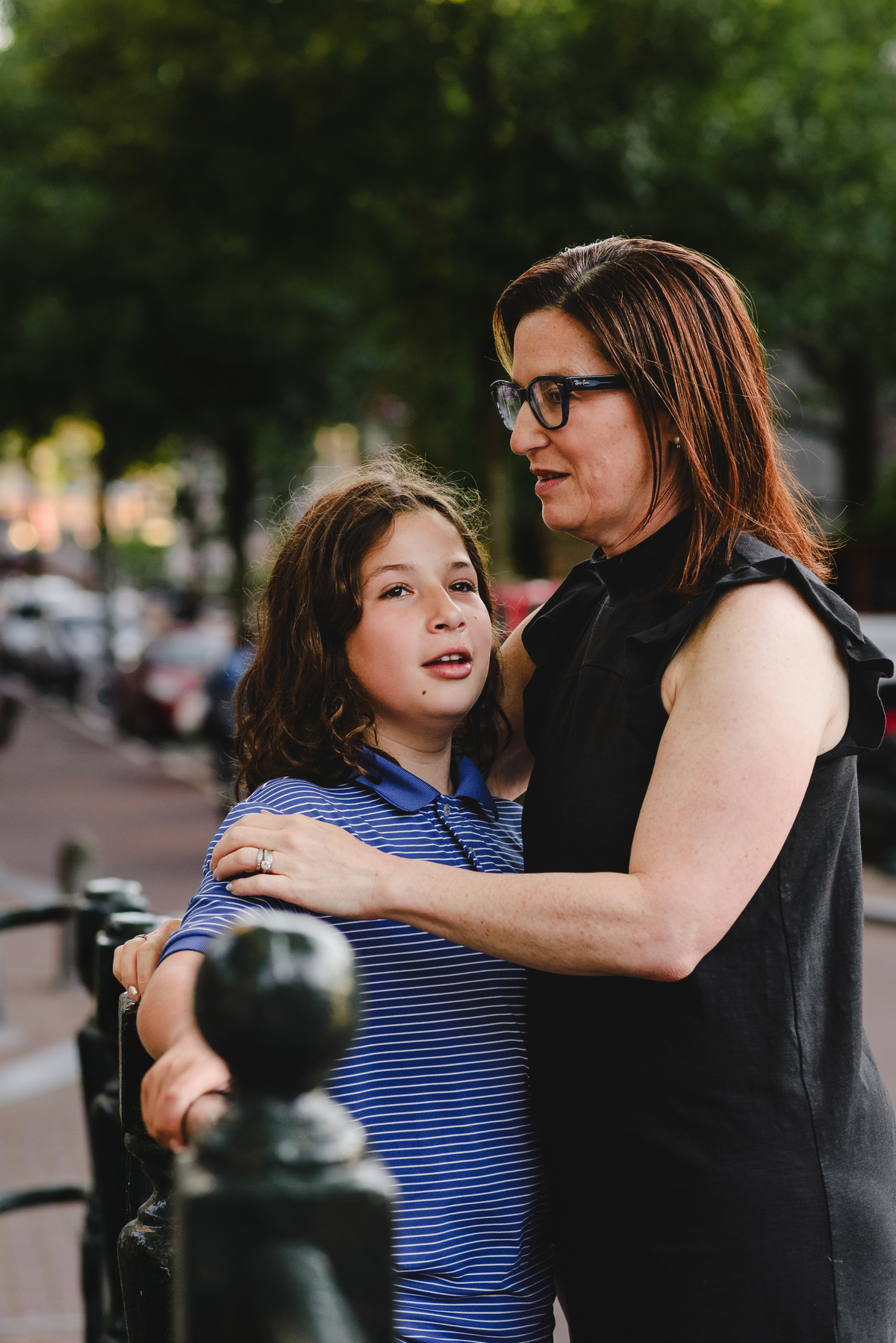 Parent and child moment captured naturally in Amsterdam streets