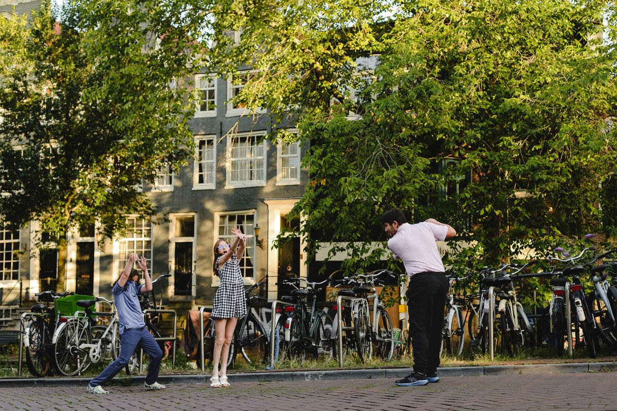 Siblings playing together during family photo session in Amsterdam