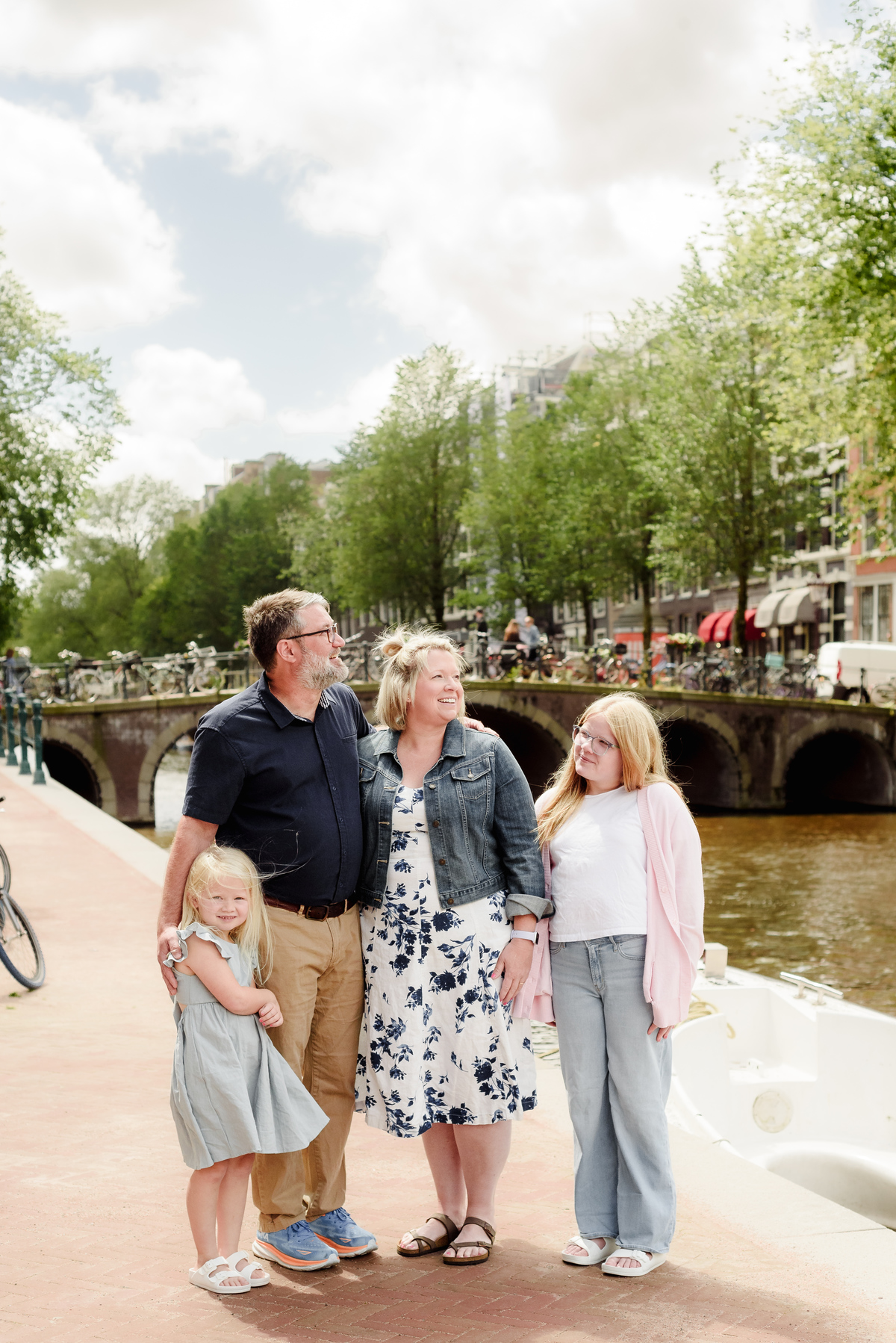 Parents and children near Amsterdam canals with soft natural light
