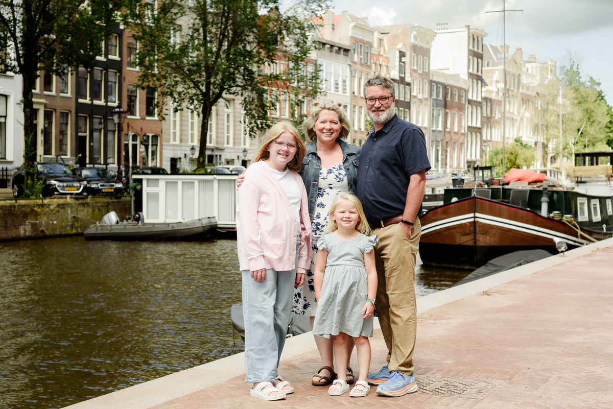 Family walking in Amsterdam city centre during morning photo session