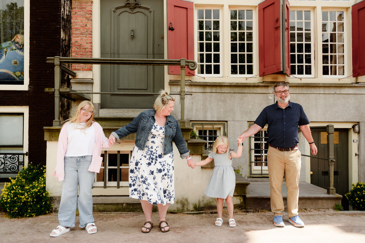 Parents and children near Amsterdam canals with soft natural light