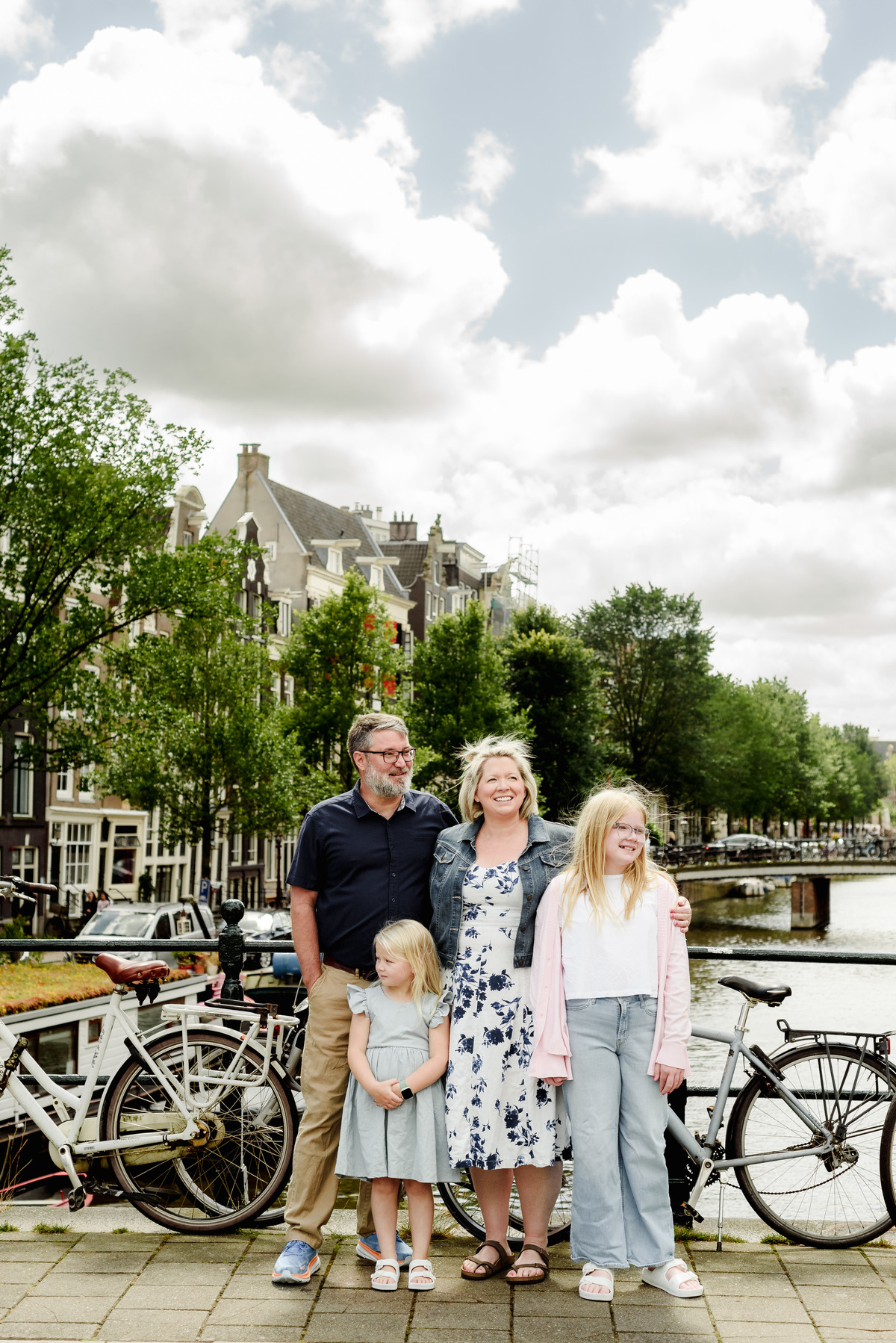 Parents and children near Amsterdam canals with soft natural light