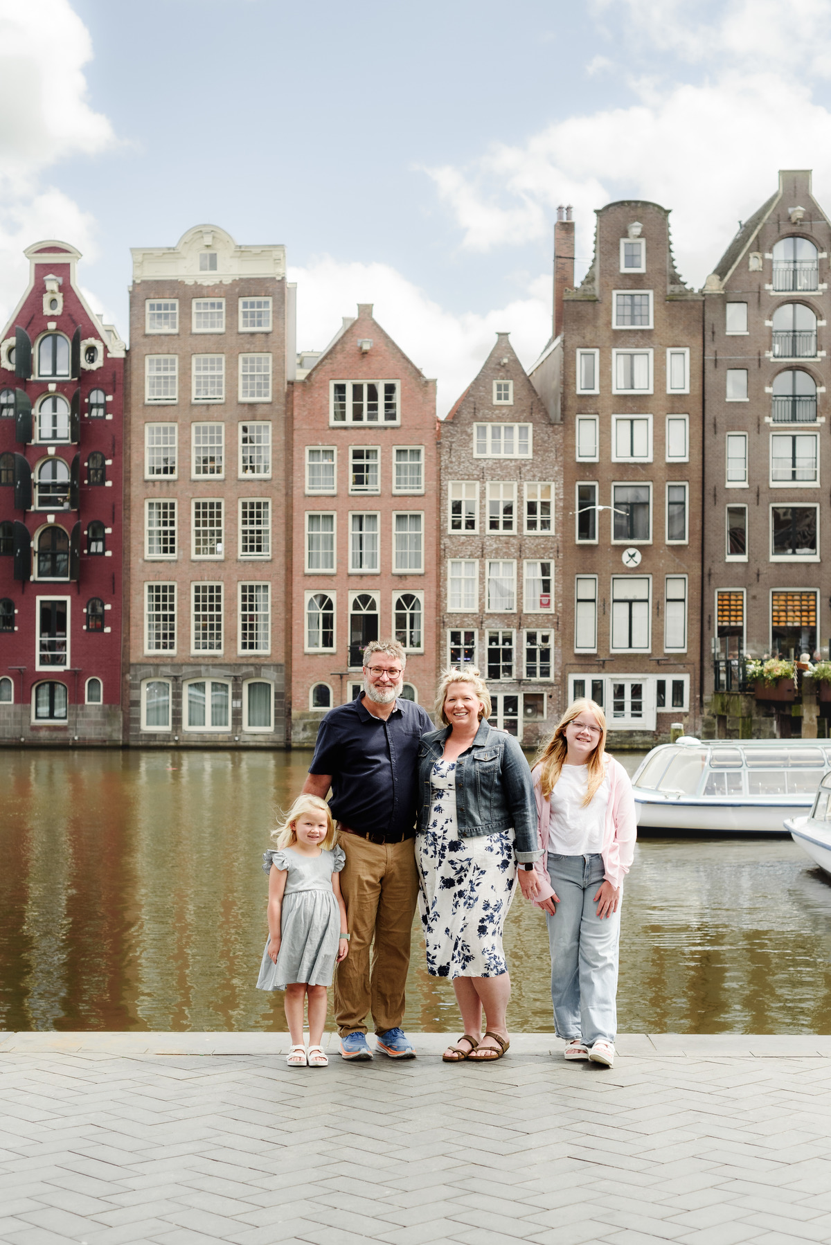 Family walking in Amsterdam city centre during morning photo session