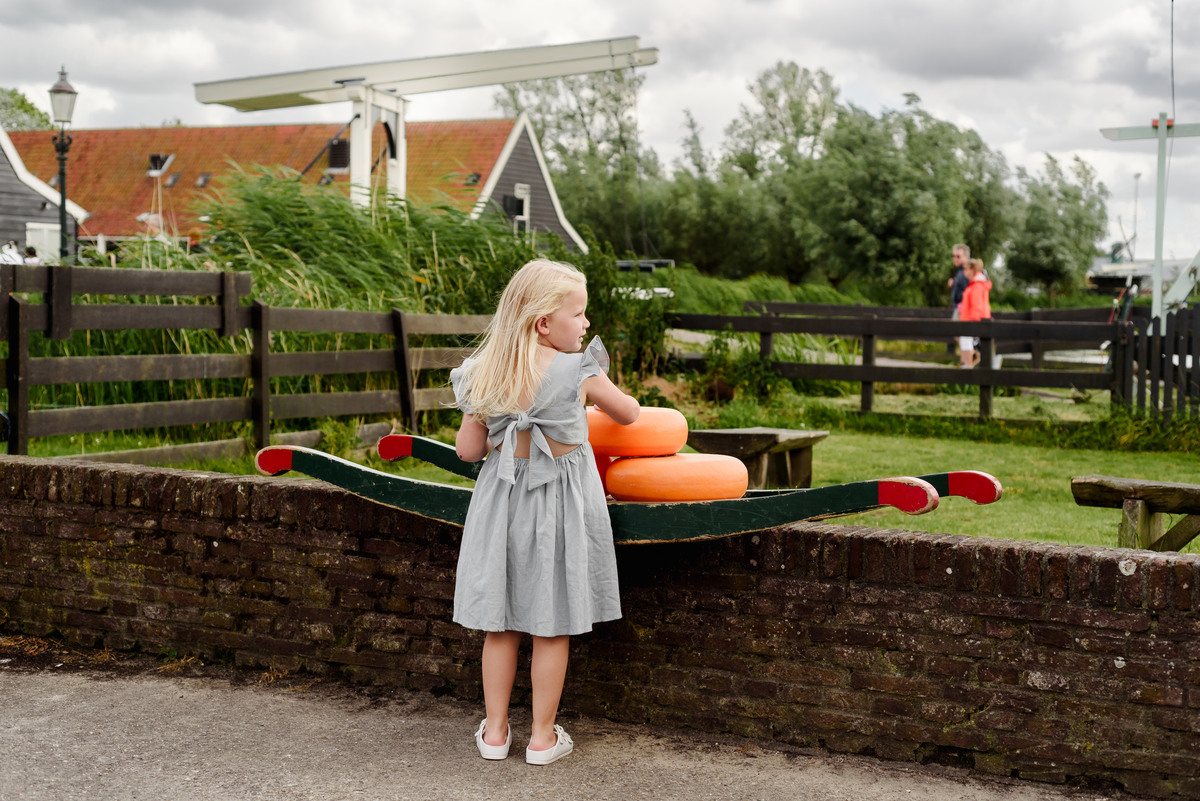 Kid portrait with traditional Dutch cheese at Zaanse Schans village