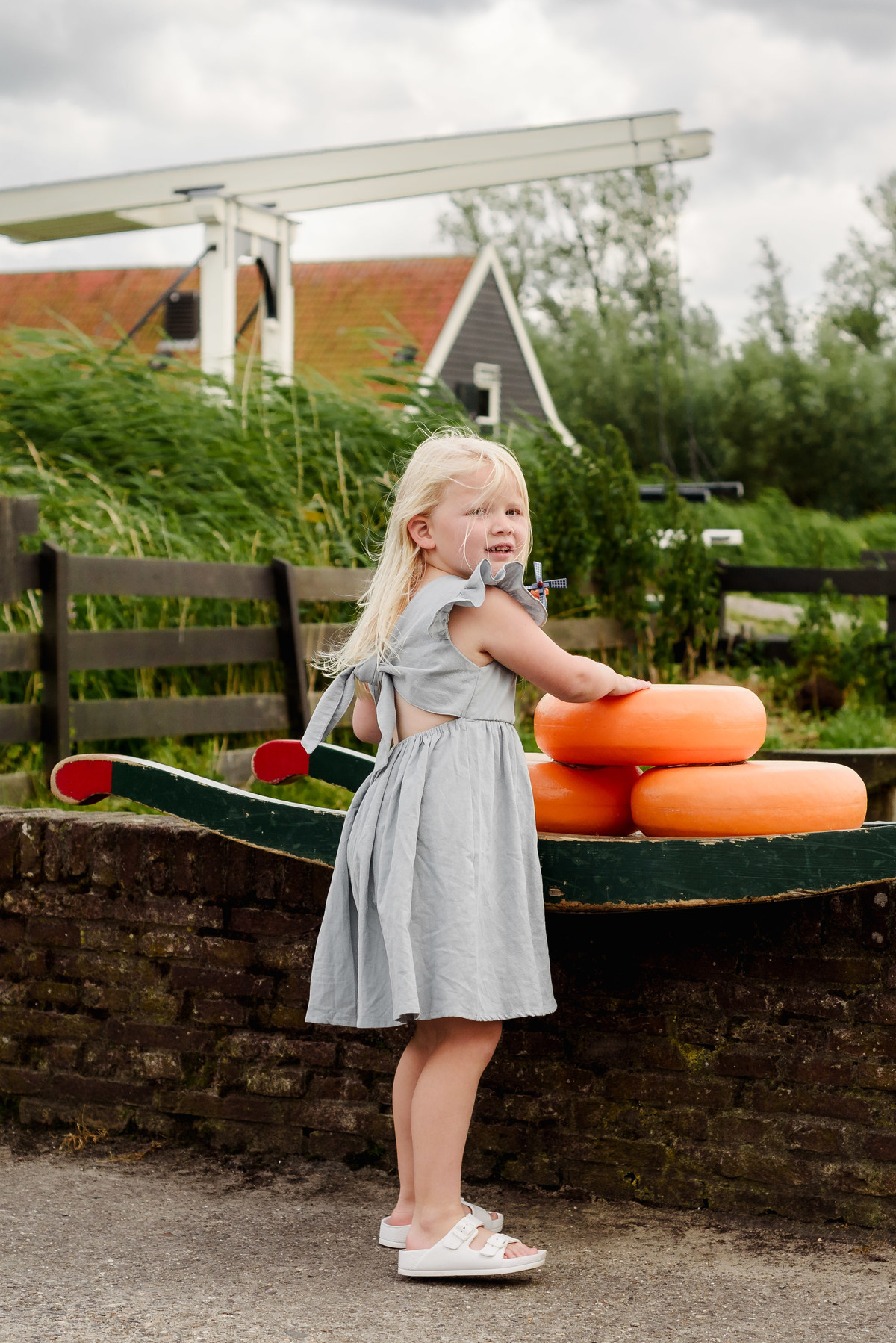 Kid portrait with traditional Dutch cheese at Zaanse Schans village