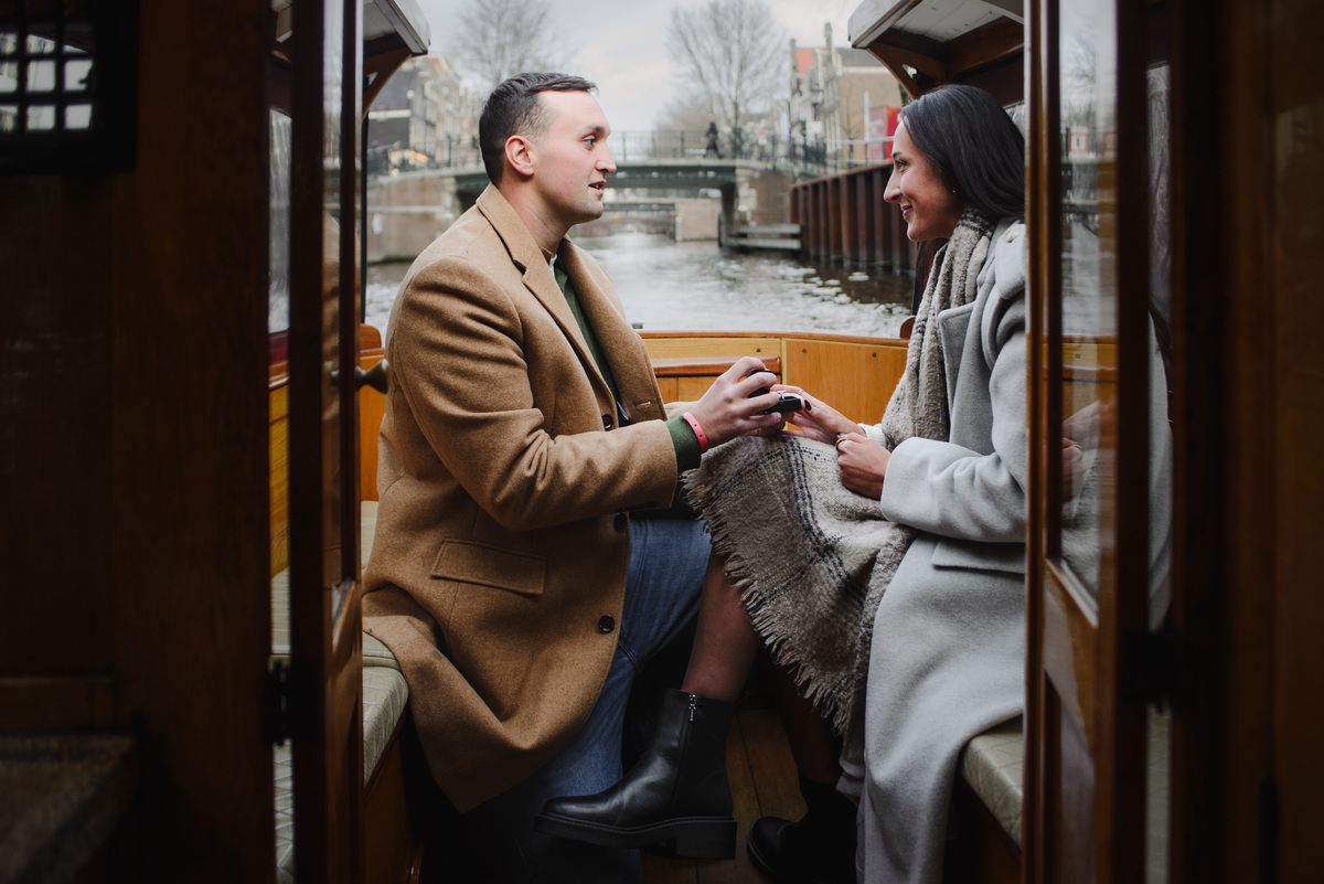 surprise proposal on canal boat Amsterdam