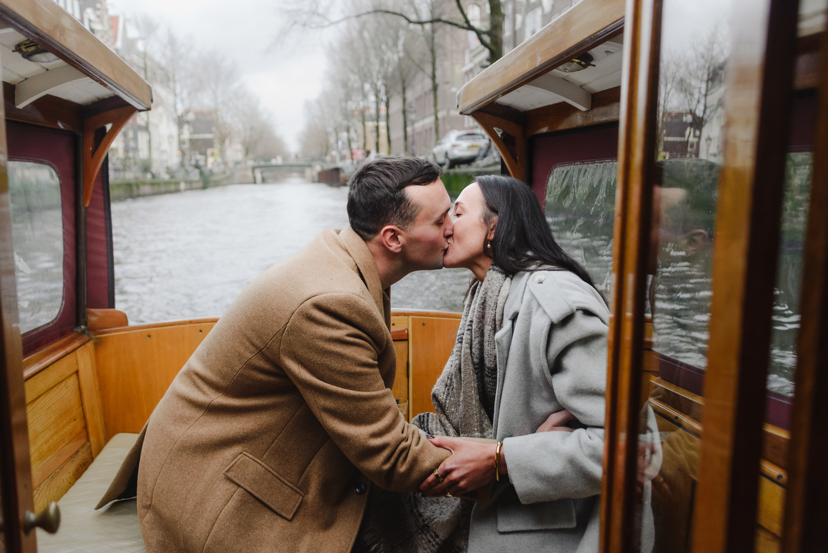 couple celebrating proposal on canal boat