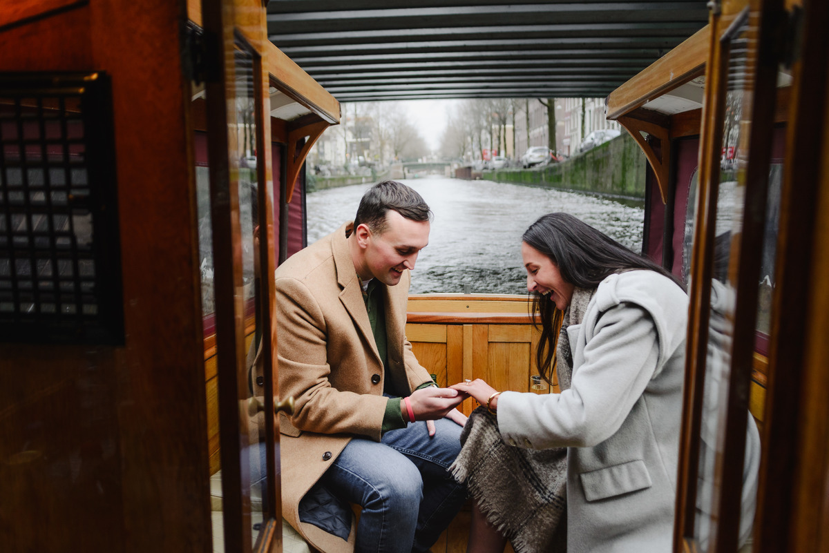 surprise proposal on canal boat Amsterdam