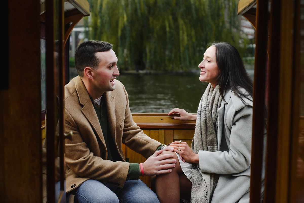 couple celebrating proposal on canal boat