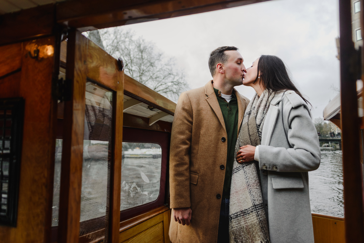 couple celebrating proposal on canal boat