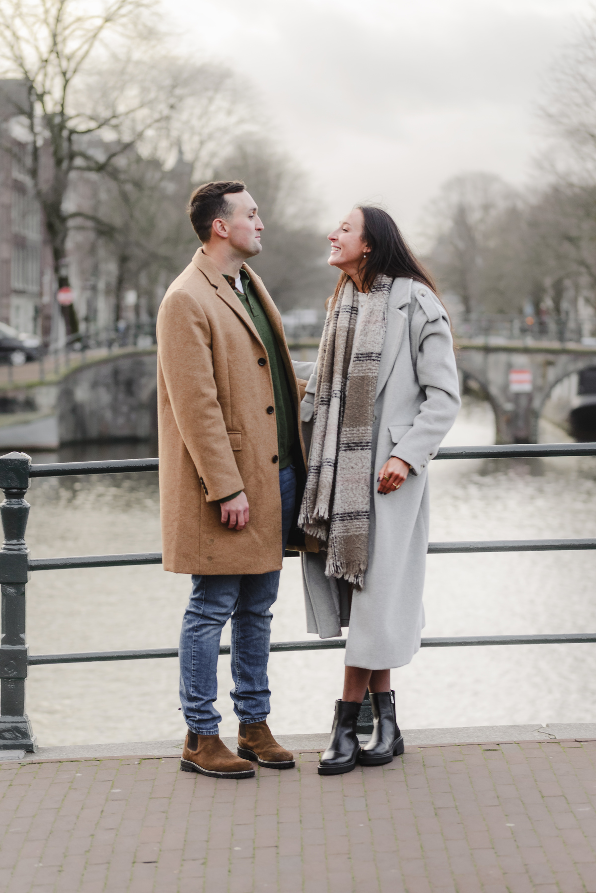 couple celebrating proposal on canal boat