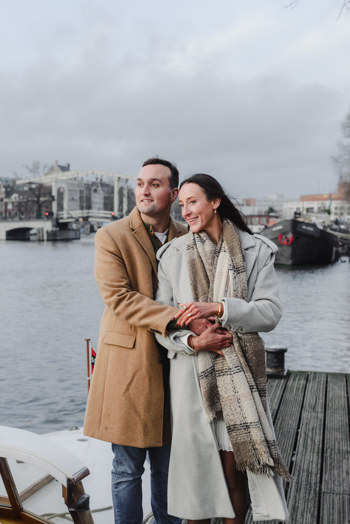 couple celebrating proposal on canal boat