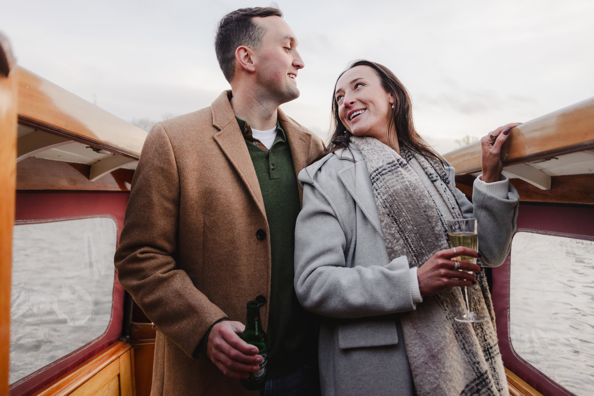 couple celebrating proposal on canal boat