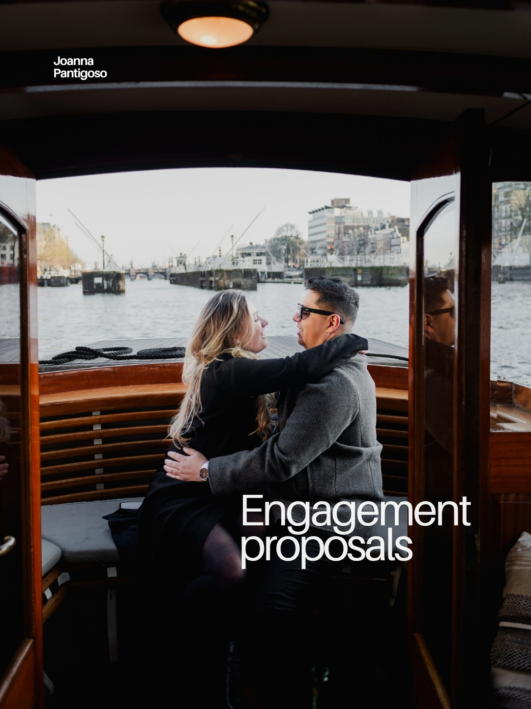 Couple during engagement proposal on a private boat in Amsterdam canals