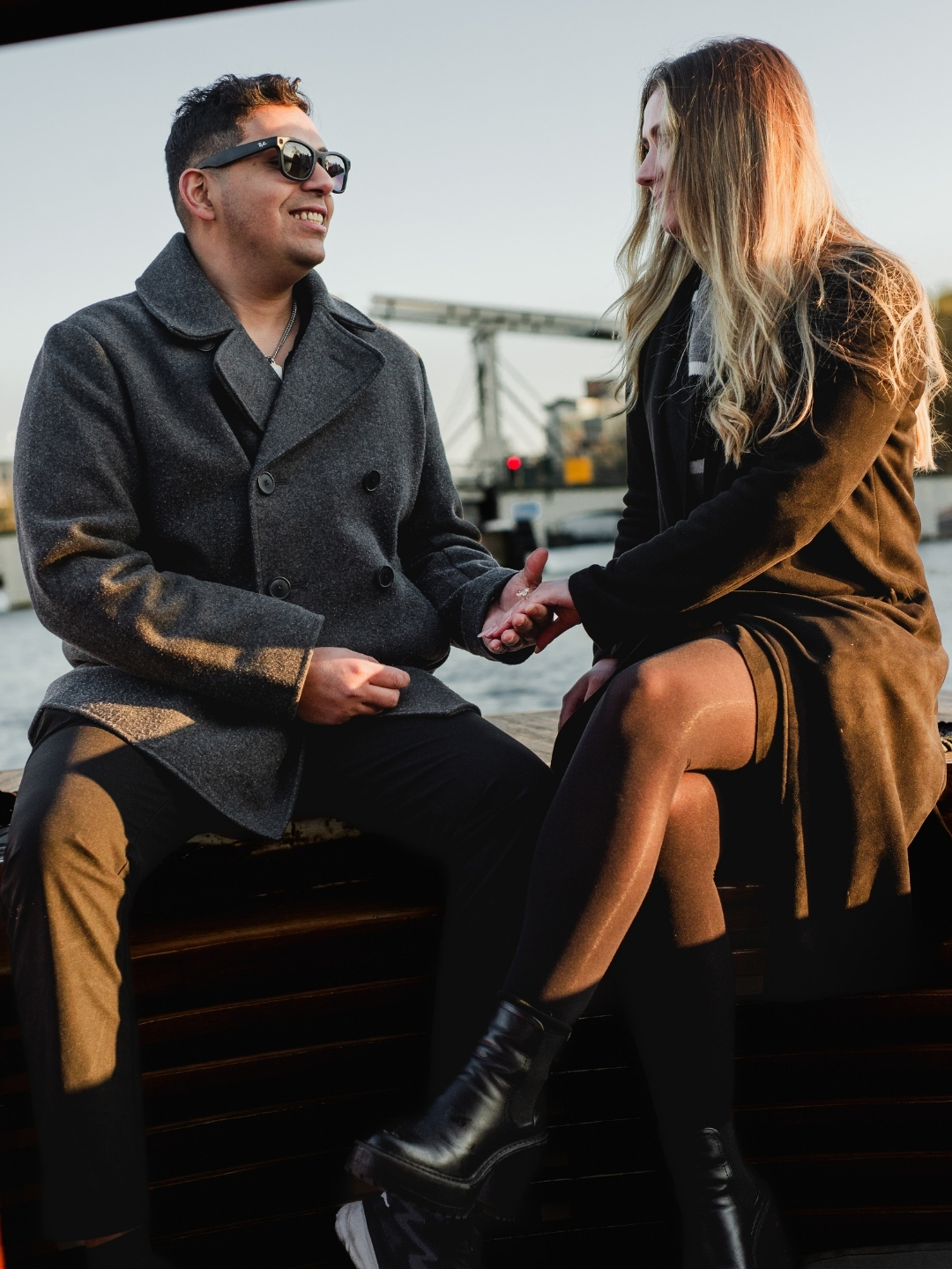 Couple during engagement proposal on a private boat in Amsterdam canals