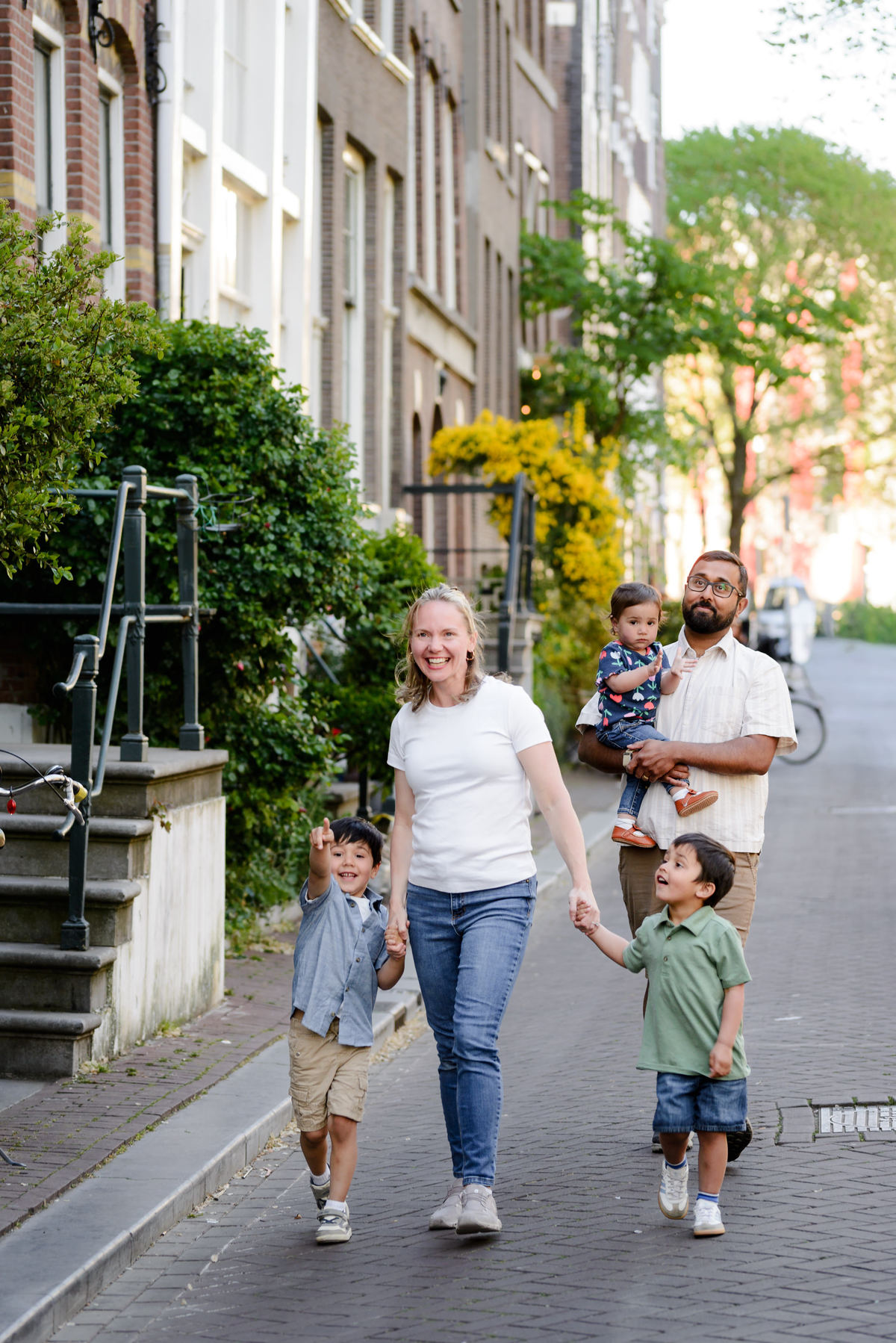 Family exploring Amsterdam canal streets
