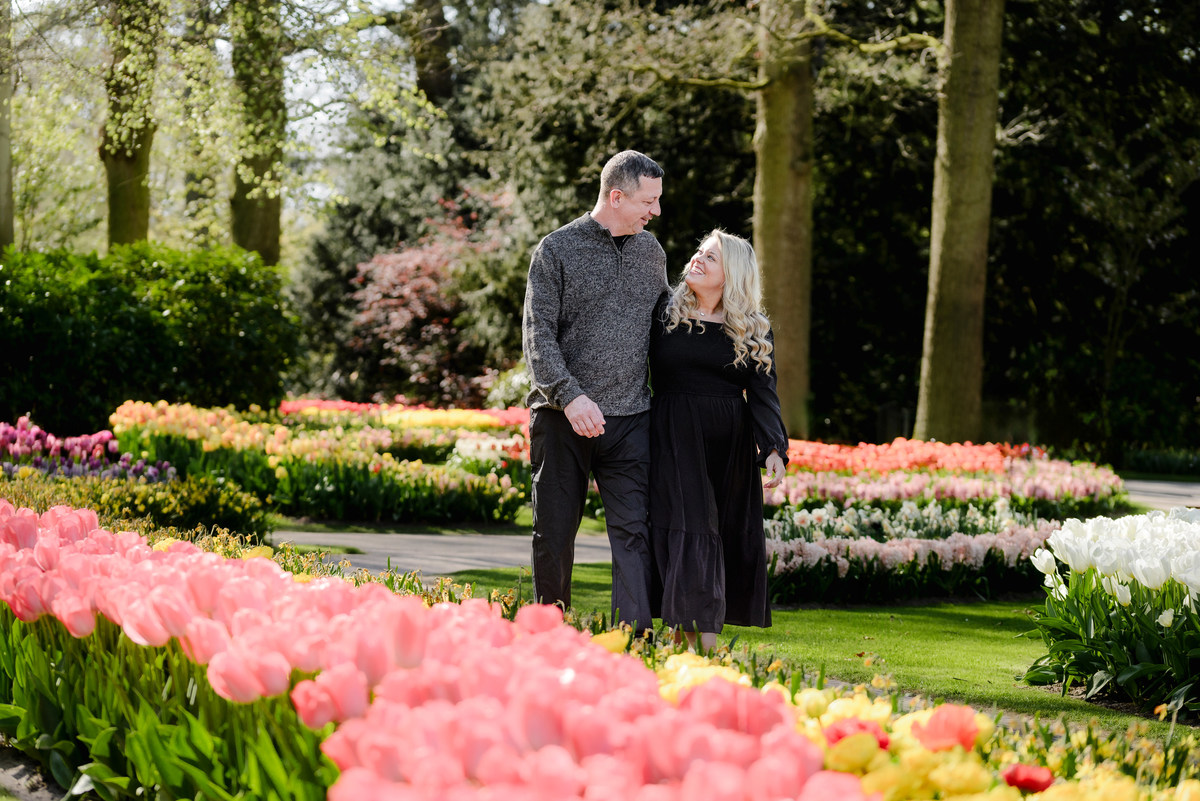 Couple walking through Keukenhof Gardens during a relaxed spring visit