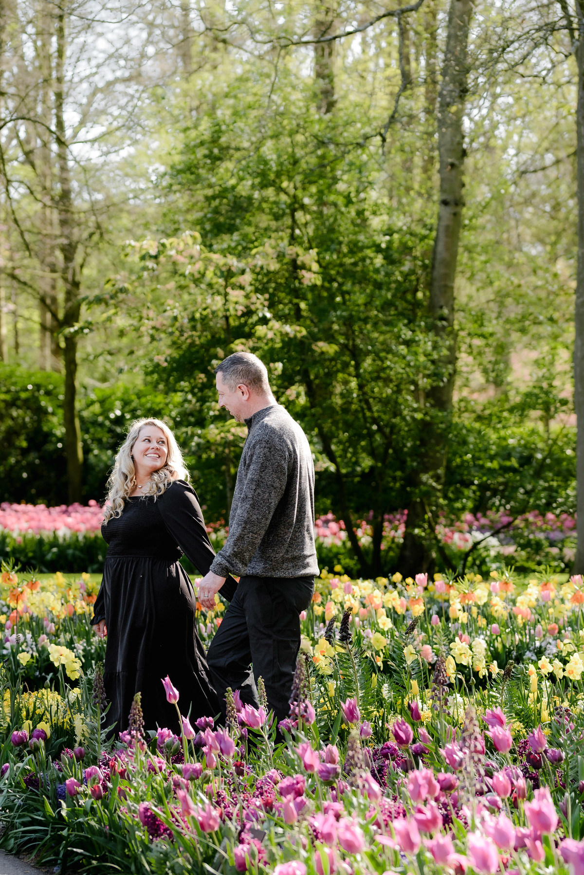 Couple walking through Keukenhof Gardens during a relaxed spring visit