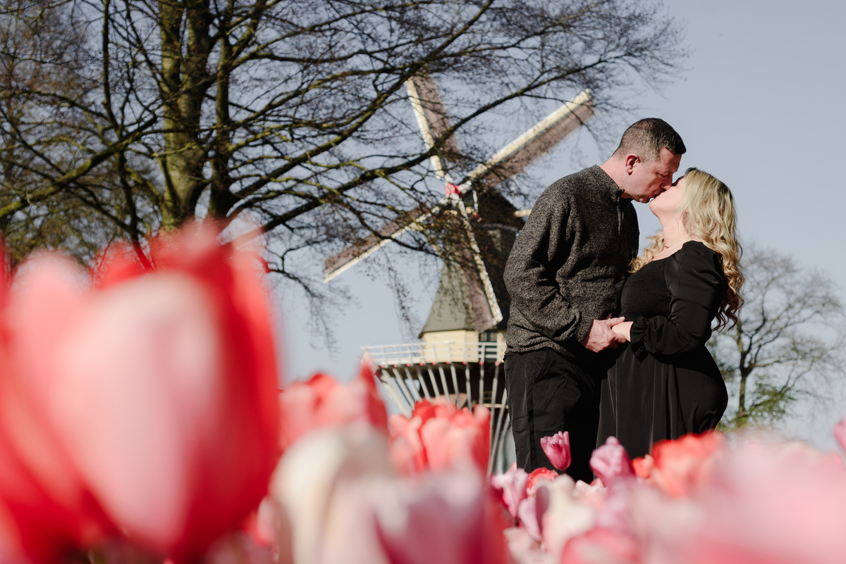 Couple enjoying a photography session among tulips in the Netherlands