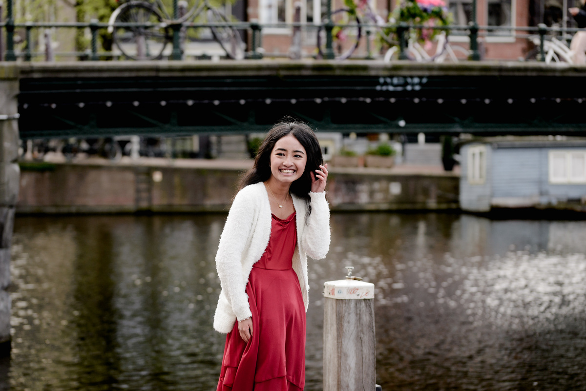 Young woman enjoying a spring day along Amsterdam's canals