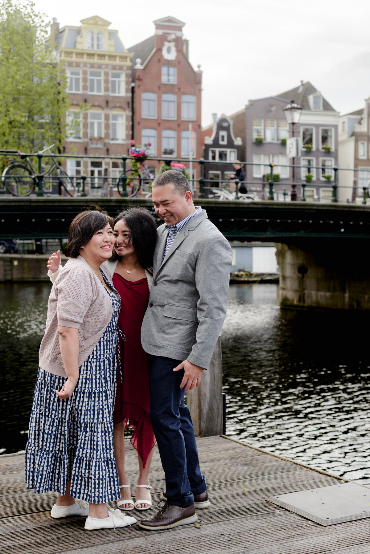 Family photography session on a canal bridge in Amsterdam