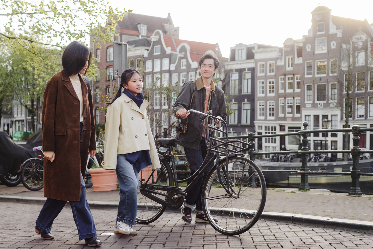 Family walking along a canal in Amsterdam