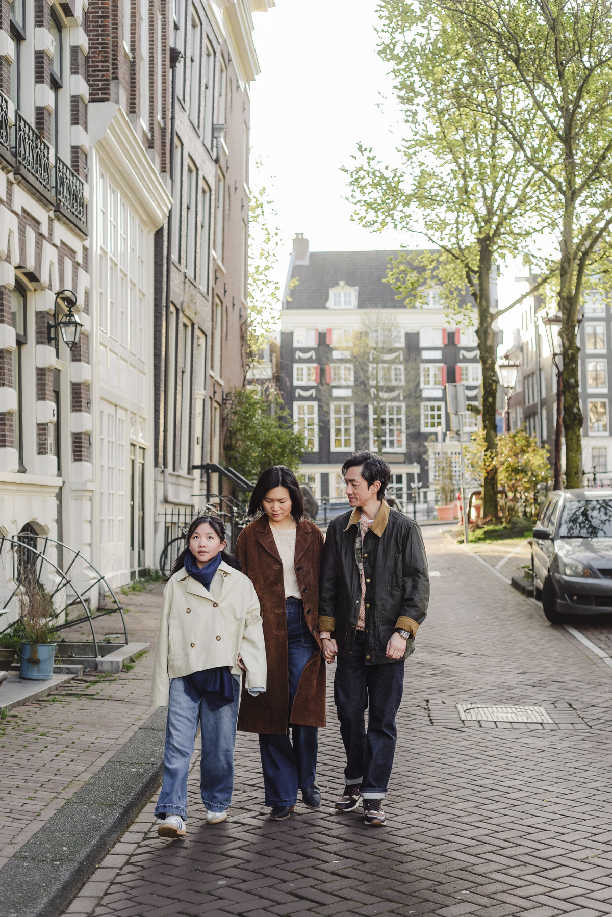 Family walking along a canal in Amsterdam