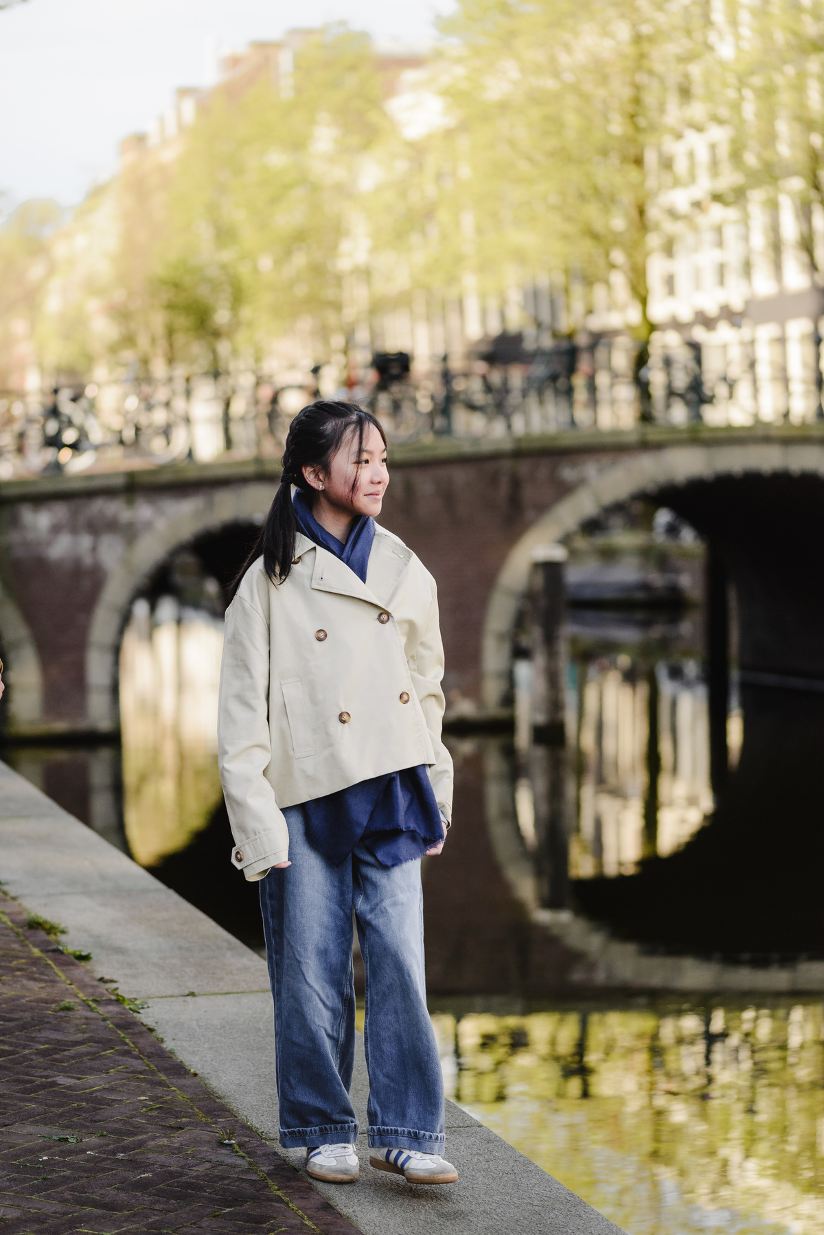 Portrait of a young girl beside an Amsterdam canal