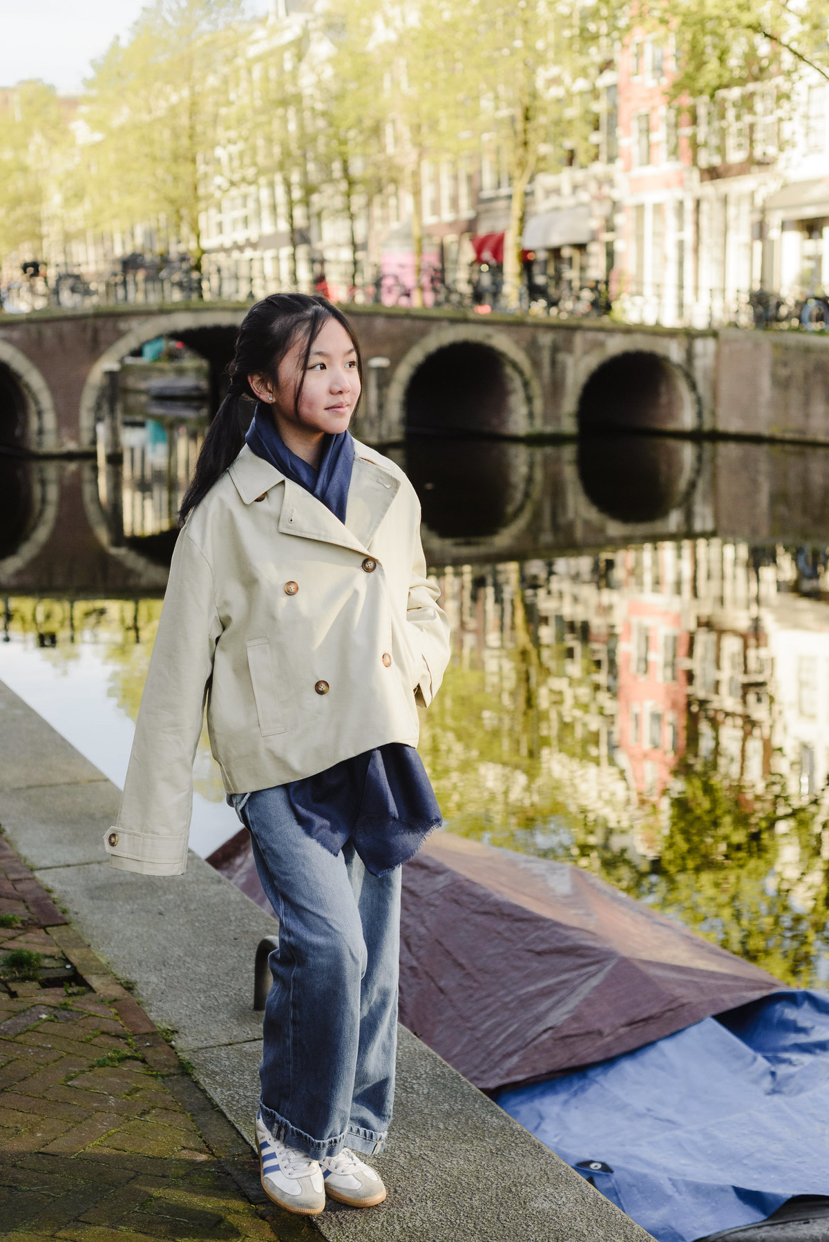 Portrait of a young girl beside an Amsterdam canal