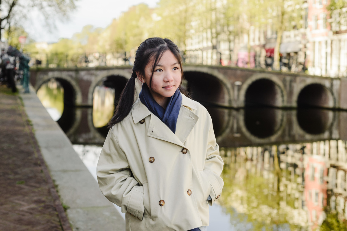 Portrait of a young girl beside an Amsterdam canal