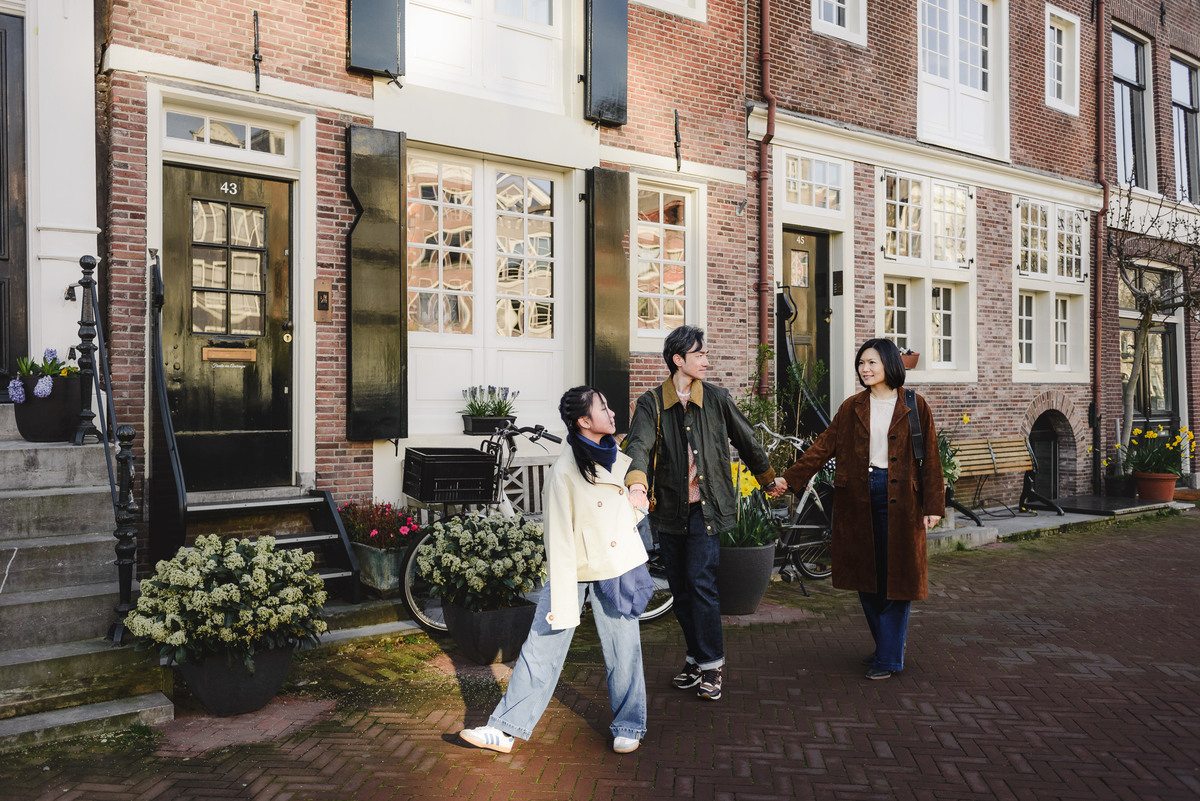 Family exploring the canals of Amsterdam together