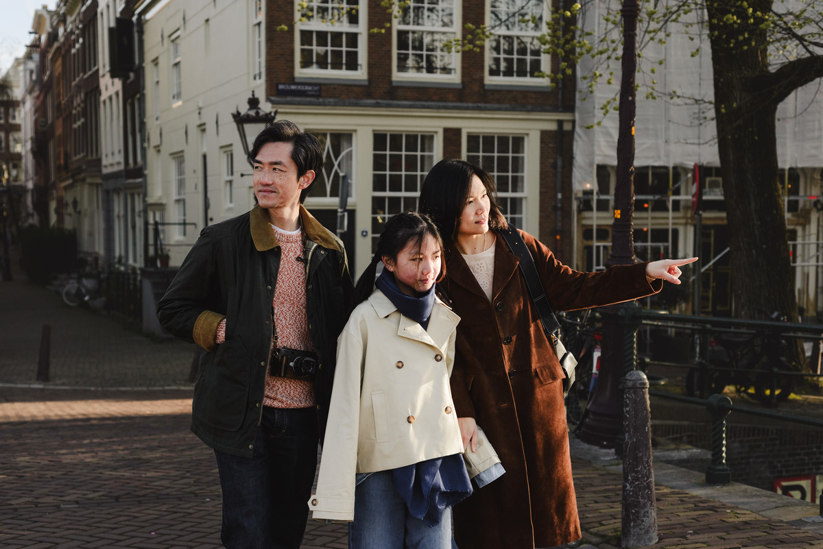 Family exploring the canals of Amsterdam together