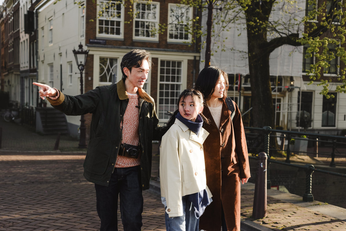 Family exploring the canals of Amsterdam together