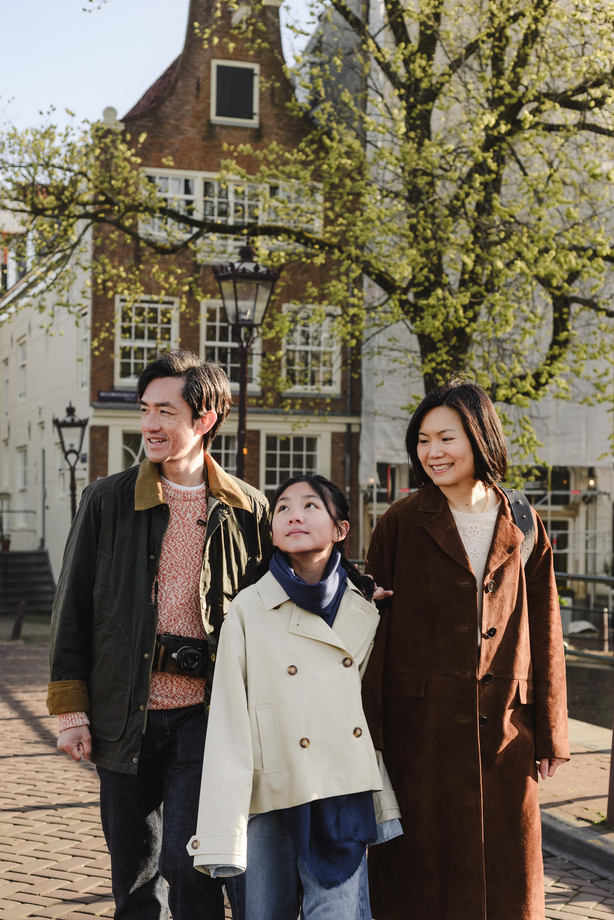 Family exploring the canals of Amsterdam together