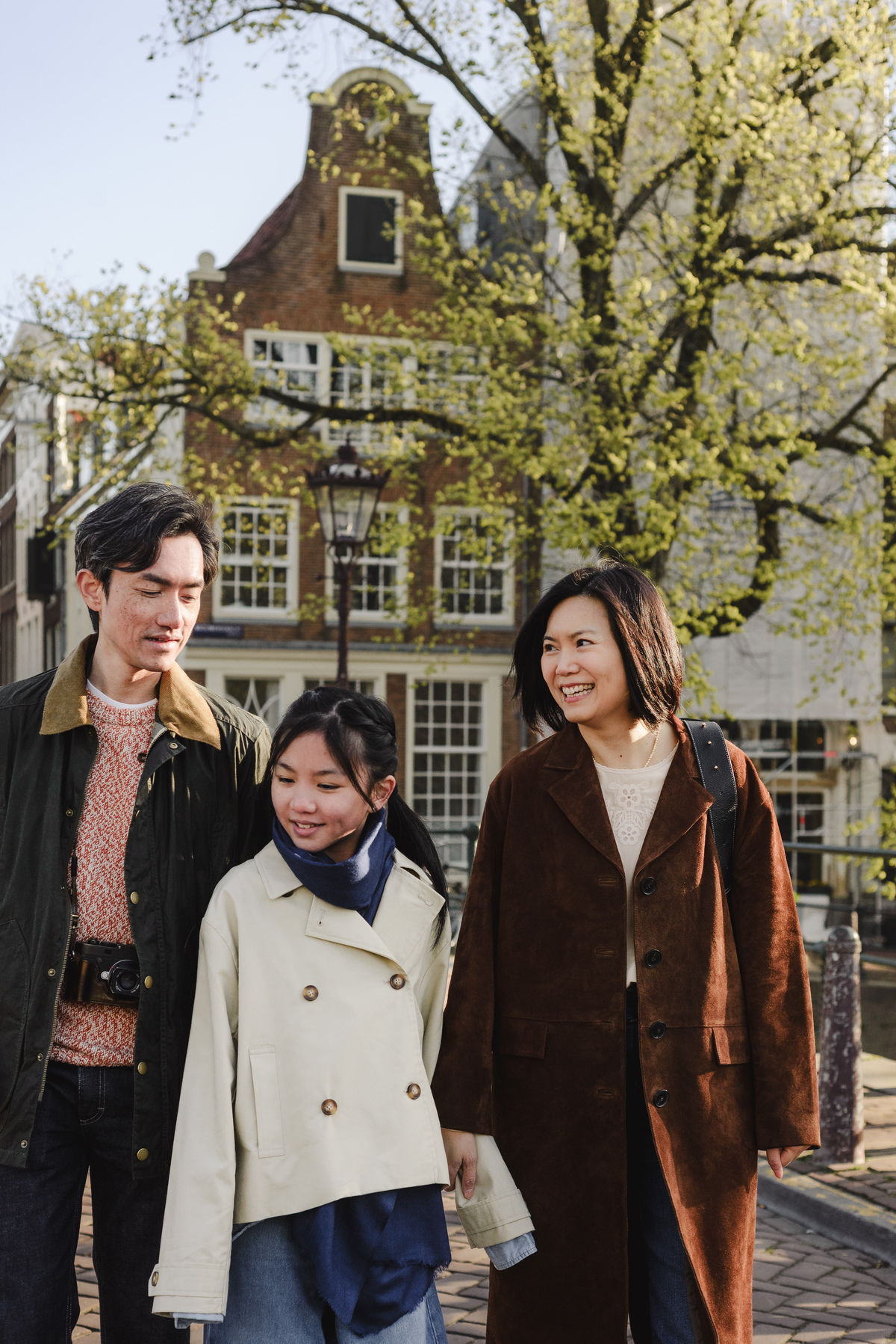 Family walking along a canal in Amsterdam