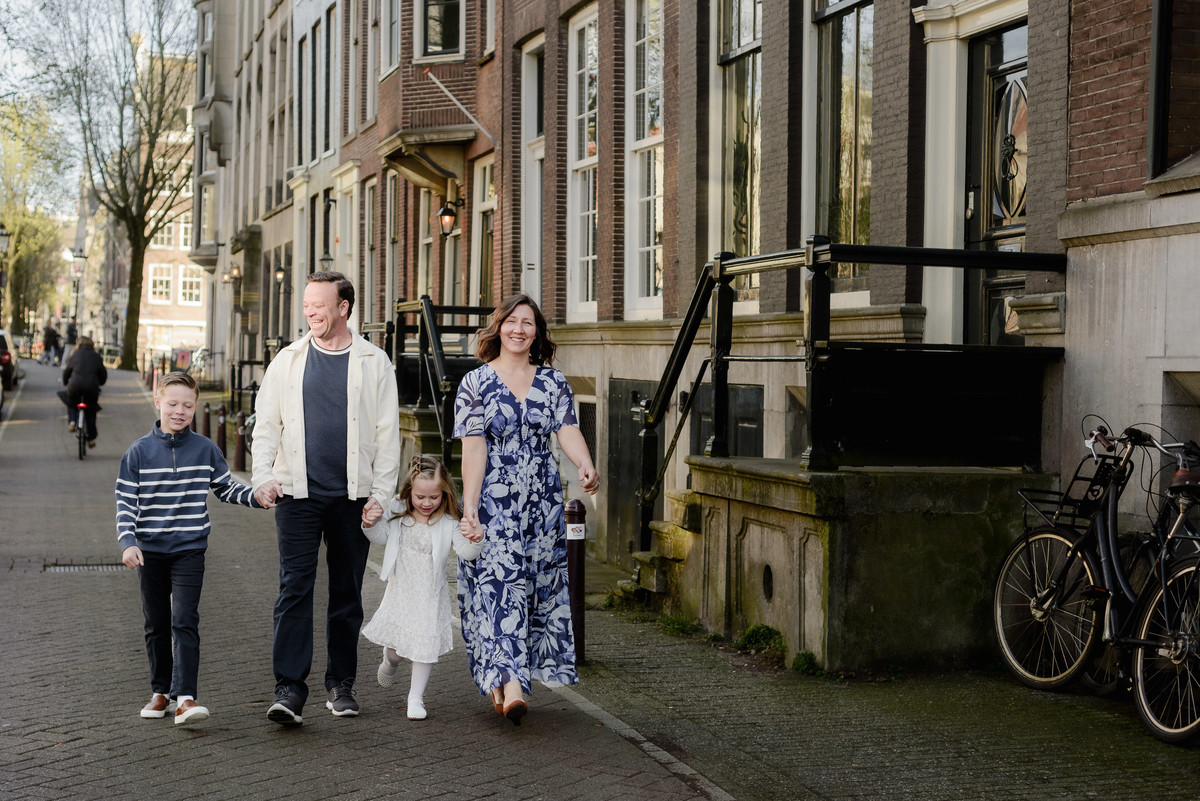 Family walking through a quiet street in Amsterdam