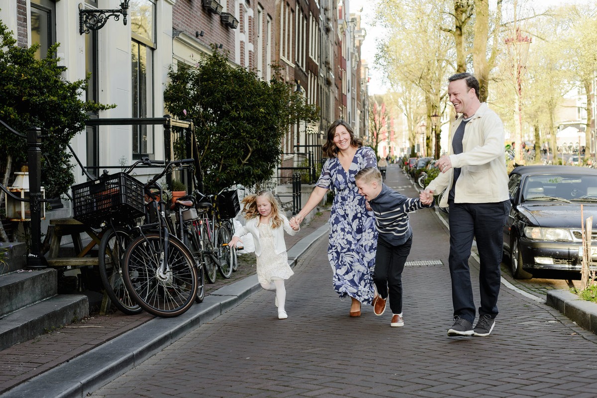 Family walking through a quiet street in Amsterdam