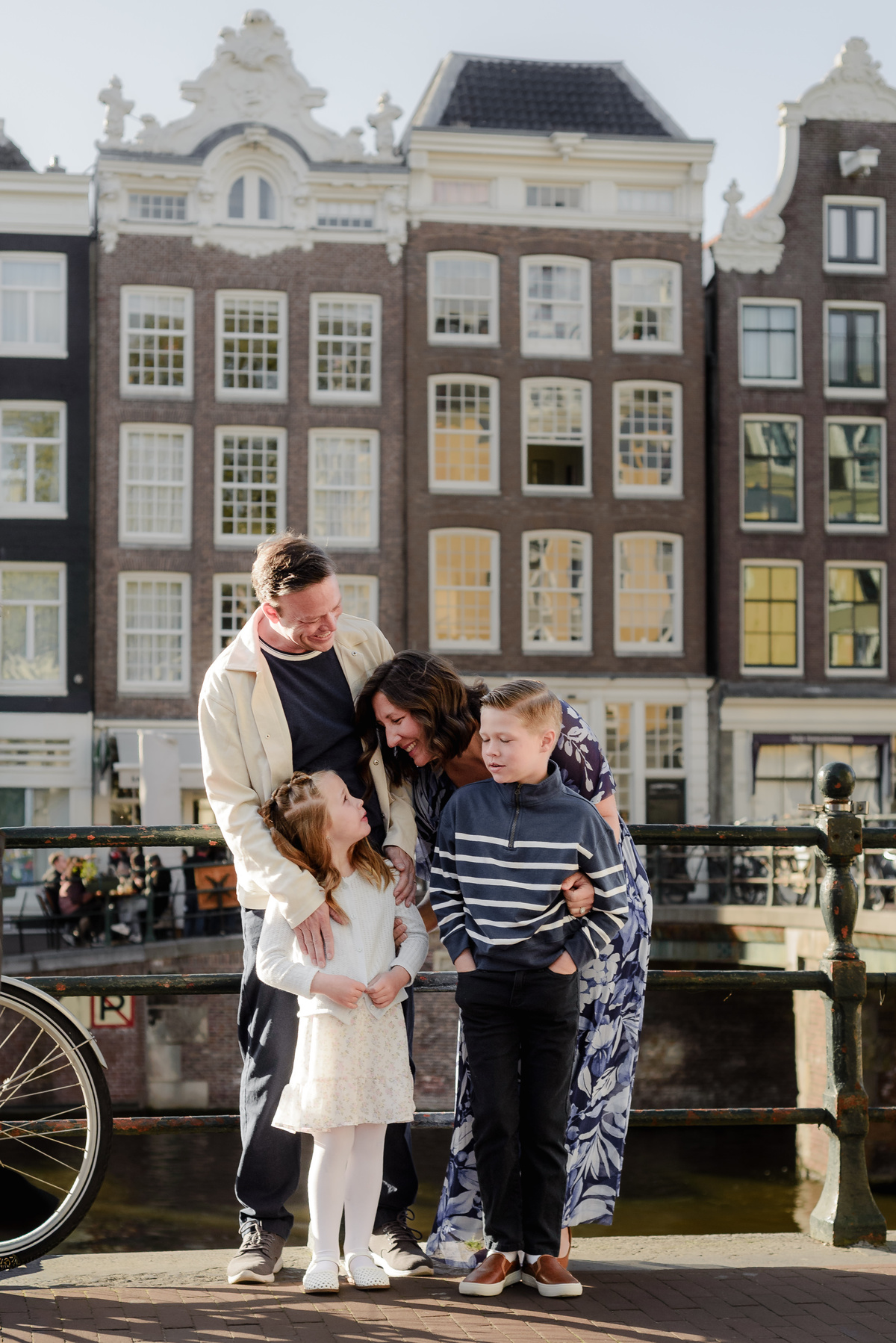 Parents embracing their children during a family photography session in Amsterdam