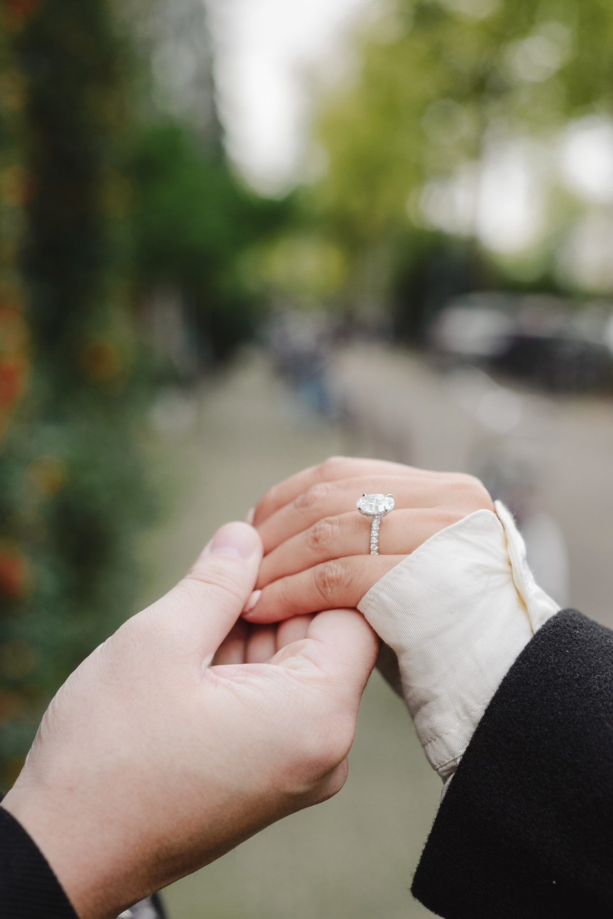 Close-up of an engagement ring on a bride-to-be's hand photographed after a surprise proposal in Amsterdam.
