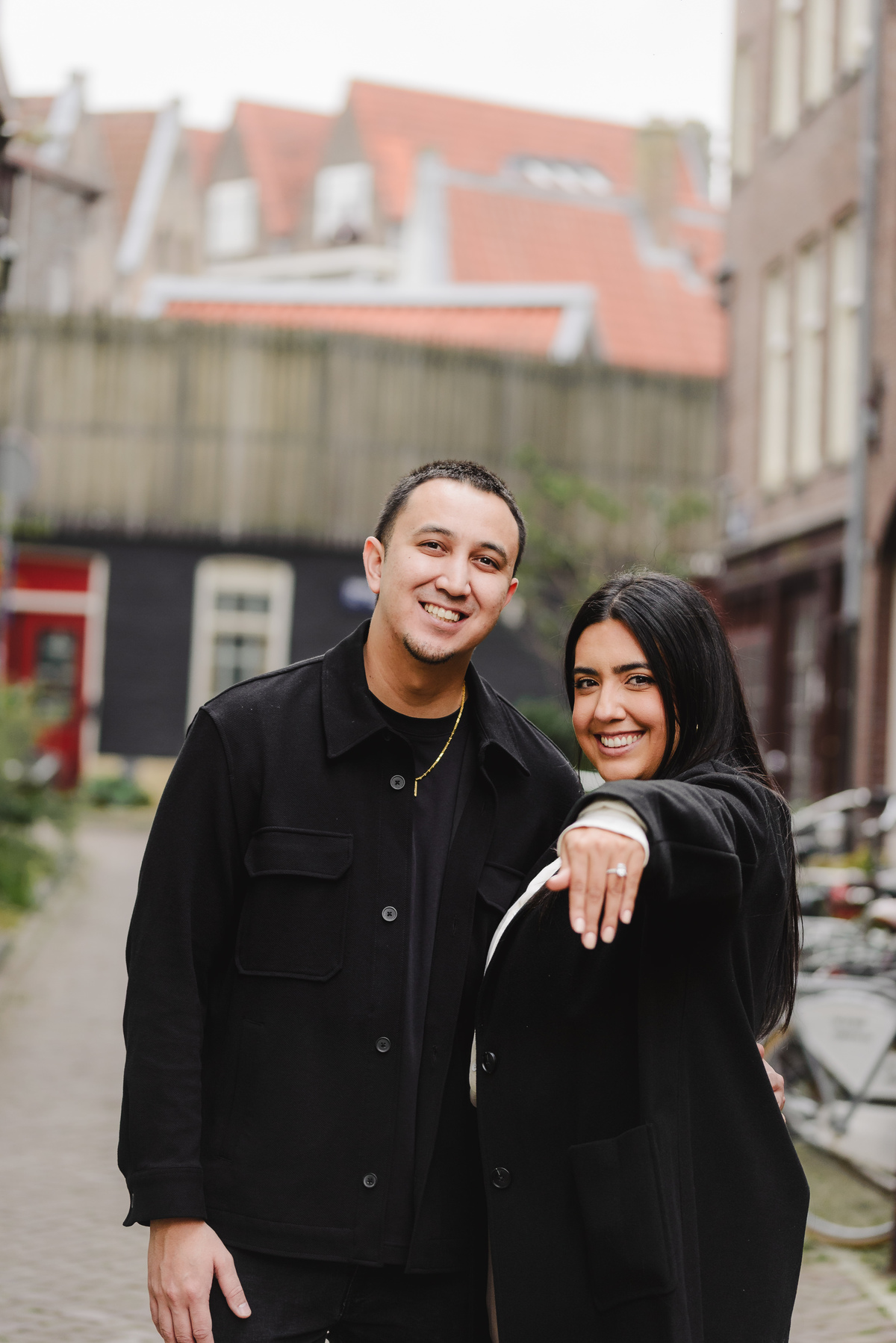 Newly engaged couple showing their ring after an engagement proposal in Amsterdam. 