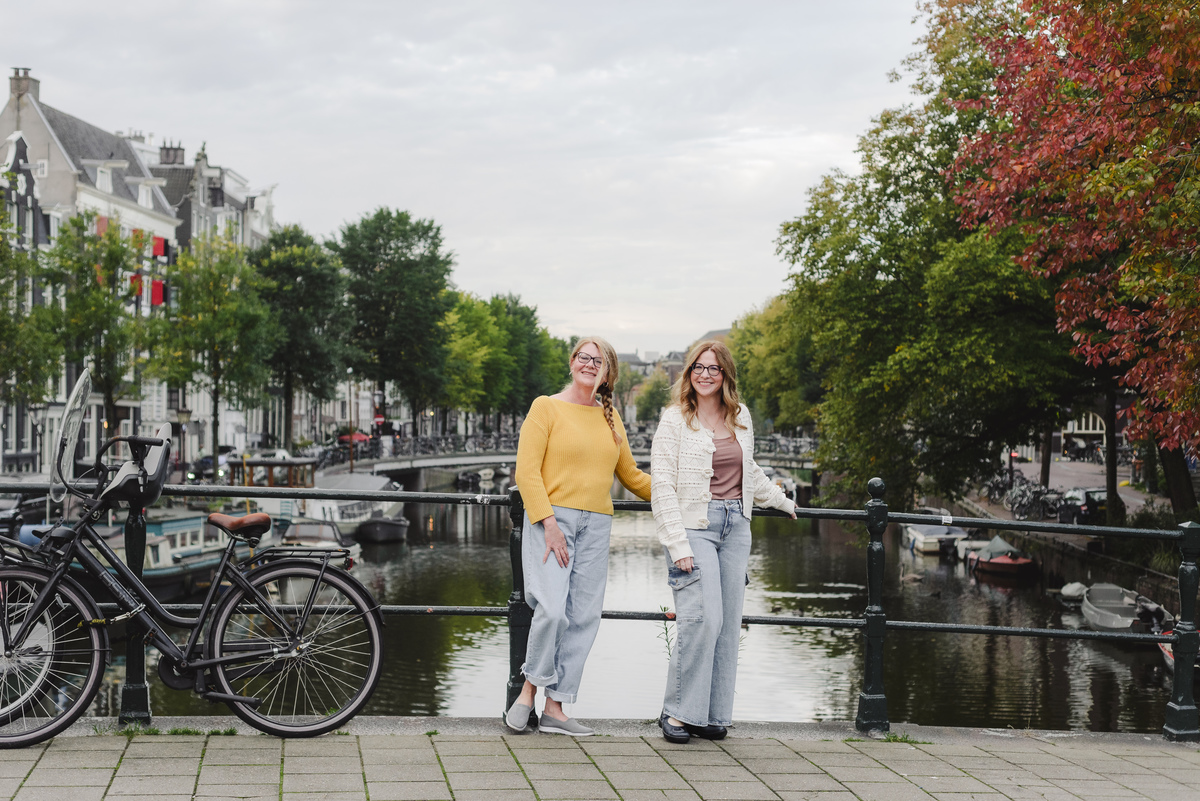 Two sisters traveling in Amsterdam are capturing their memories during the trip with a morning vacation photography session