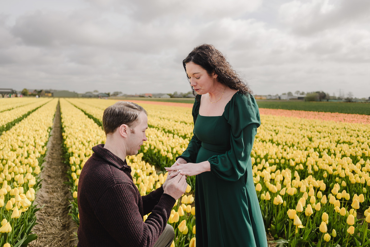 Couple smiling together after a surprise proposal in the Netherlands.