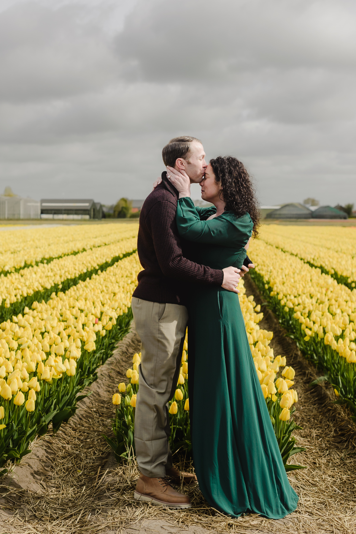 Romantic portrait of a couple among Dutch tulips.
